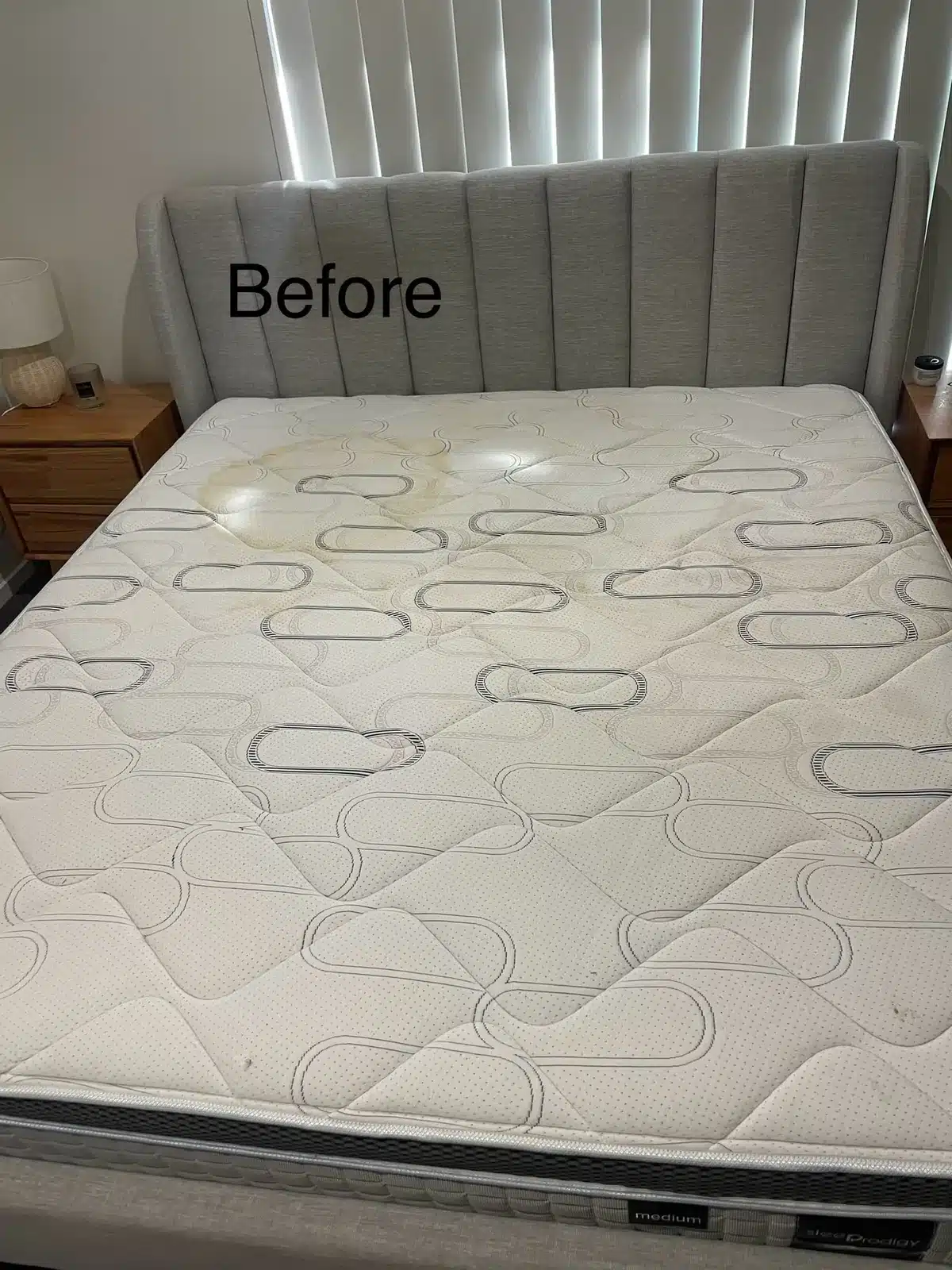Before: queen mattress with sweat staining cleaned and sanitised