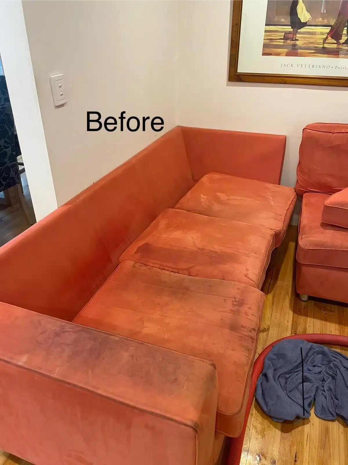 Before: heavily stained orange suede corner lounge cleaned