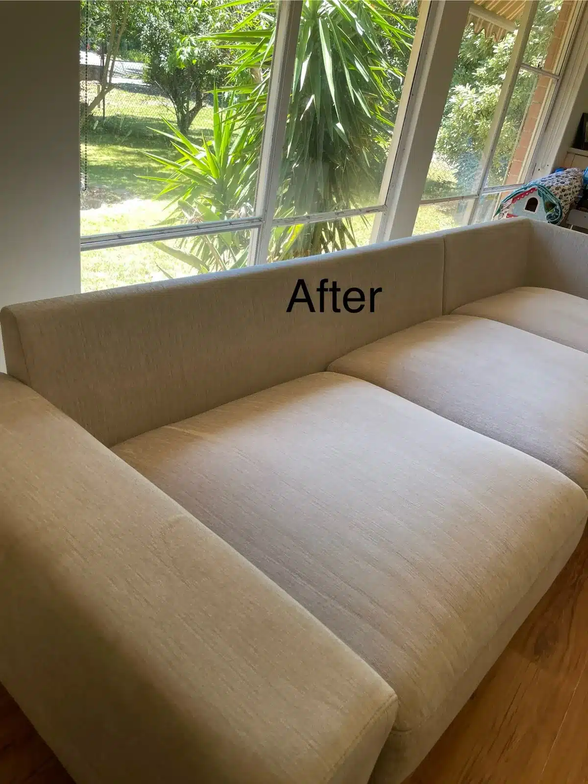 After: cream fabric sofa with soiled arms and seats cleaned