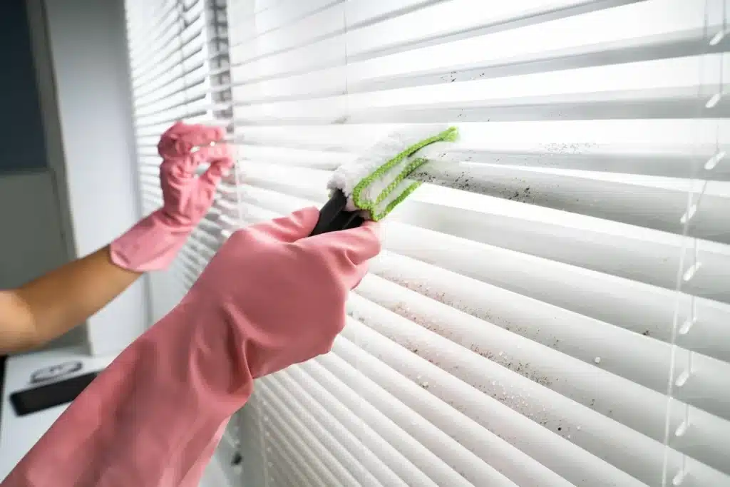 Blind cleaning removing dust in a Melbourne home