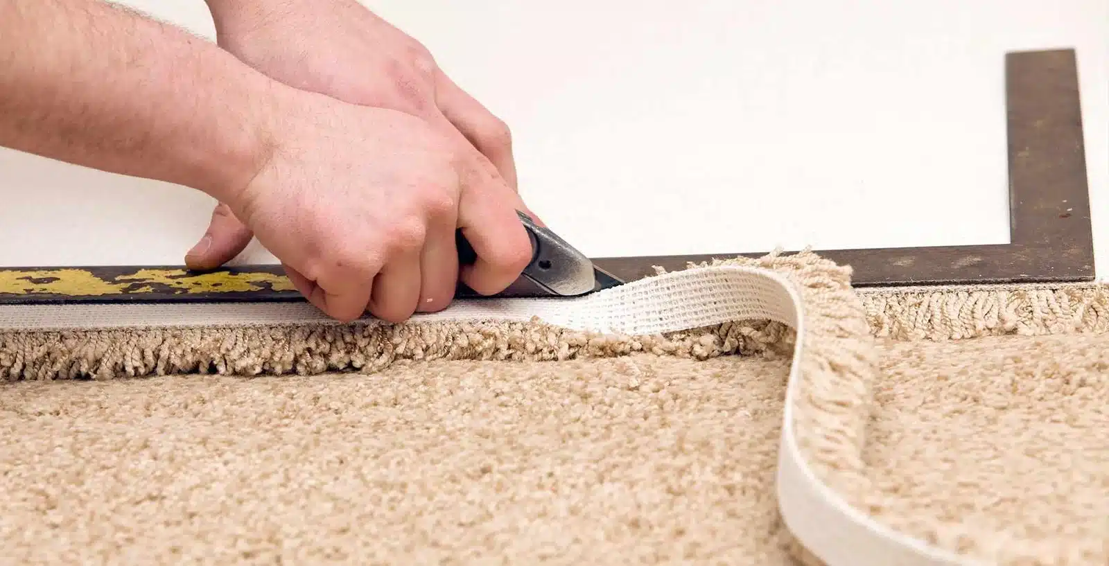 Carpet repair technician patching damaged carpet in a Ferntree Gully home